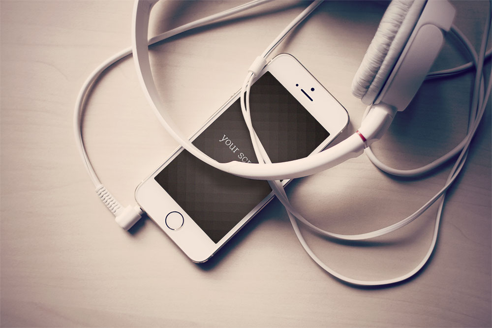 free iPhone mock-ups with headphones and laptop